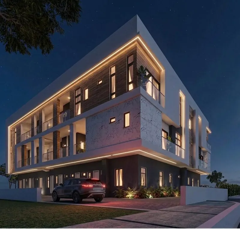 Night view of the apartment building with lit balconies